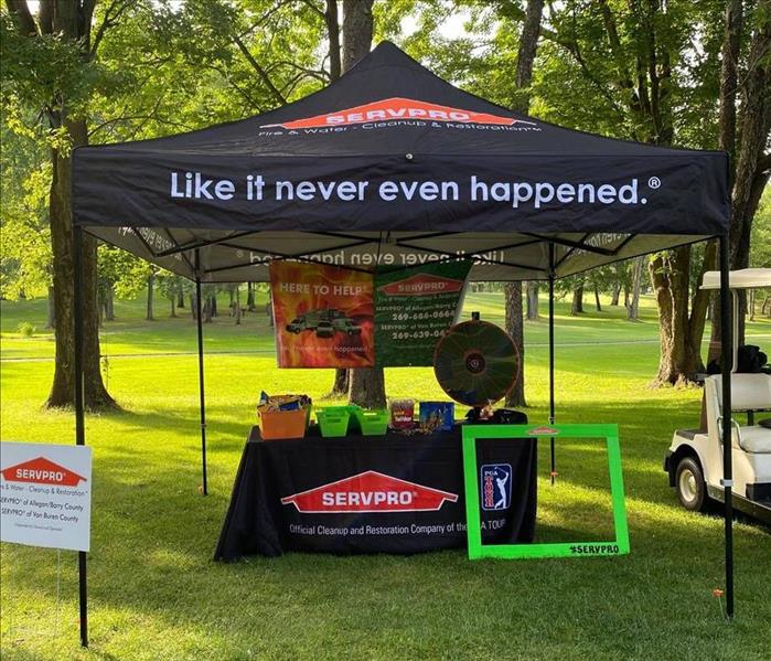 SERVPRO tent with table display setup at golf outing