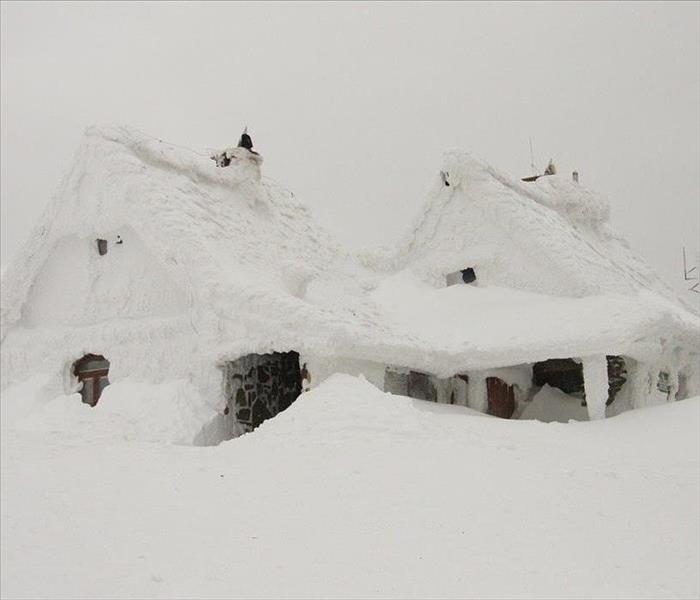 House covered in snow and ice